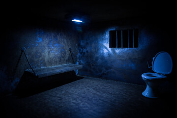 Jail or prison cell. Old grunge prison miniature. Dark prison interior creative decoration. Empty...