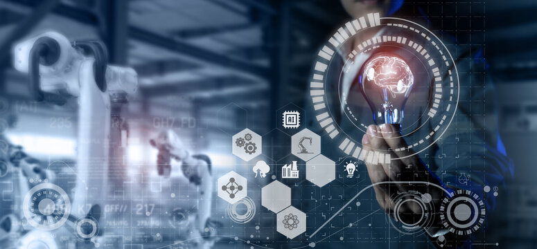 smart industry 4.0 futuristic technology concept, engineer hold the light bulb with the brain of artificial intelligence to control robot with analytic operation robotic process line in manufactoring