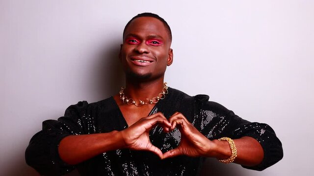 brazilian gender fluid male dressed as female with gorgeous make up in studio white background