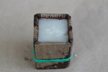Neatly tied wooden mold with sugar syrup 