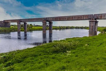A view from the River Trent levy of the abandoned railway viaduct at Fledborough, Nottinghamshire in springtime