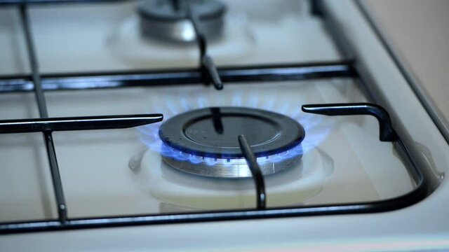 The gas burner lights up in the kitchen
