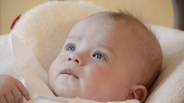 Cute baby eats from a spoon mom feeds, food, nutrition, childhood concepts