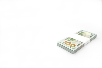 One pack (bundle) of 100 dollar bills with the reverse side up fastened with a white paper tap on a white background