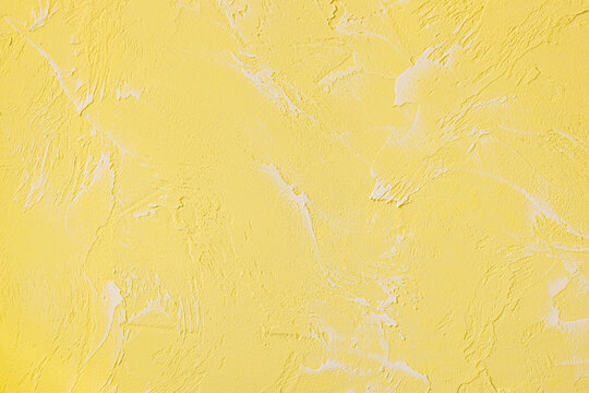 abstract texture of a yellow concrete wall