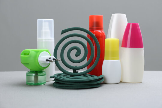 Set Of Different Insect Repellents On Grey Background