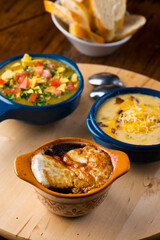 French Onion Soup. Classic traditional french restaurant bistro menu item. French onion soup, yellow onions reduced in broth topped with cheese melted and served with homemade baguettes. 