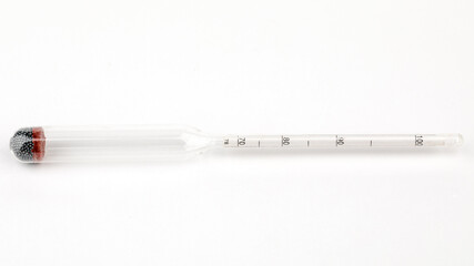 device for measuring the degree of alcohol in a distillery on a white background