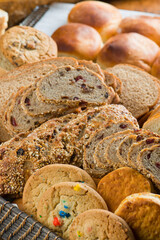 Bread. Bread, loafs, rolls, baguettes, bagels, slices of fresh homemade bread. Traditional classic bakery goods. Made from scratch in a bakery by a baker. 