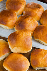 Bread. Bread, loafs, rolls, baguettes, bagels, slices of fresh homemade bread. Traditional classic bakery goods. Made from scratch in a bakery by a baker. 
