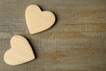 Decorative hearts and space for text on wooden table, flat lay. Valentine's Day