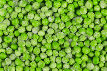 Frozen green peas as a background. Concept of homemade preparations for fast cooking. Healthy vegetarian food concept