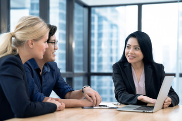Estate agent shaking hands with customer after contract signature, Successful lawyer giving consultation to family couple about buying house.