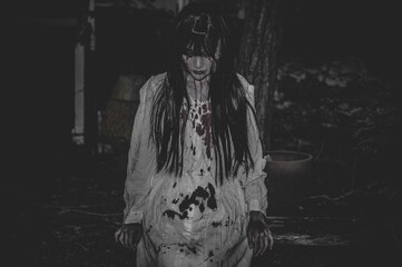 Portrait of asian woman make up ghost,Scary horror scene for background,Halloween festival concept,Ghost movies poster