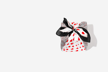 Stylish gift wrapping traditional Japanese furoshiki style. Valentines Day concept