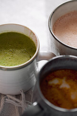 Three cup of cocoa with coconut milk. Concept of cosy winter holidays drink
