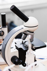 Professional microscope on a workplace in a laboratory