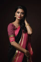 Fotobehang Beautiful Indian woman wearing traditional sari dress © blackday