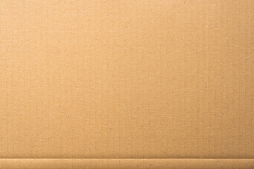 Brown cardboard sheet texture of packaging material. The structure of a carton surface can be used as a background.