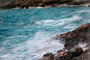 waves crashing on rocks