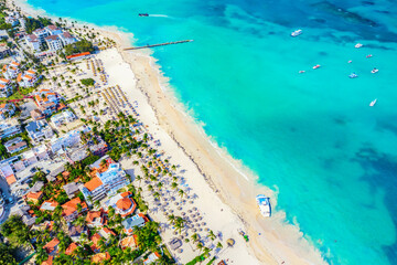 Aerial drone view of beautiful caribbean tropical beach with palms and boats. Bavaro, Punta Cana,...