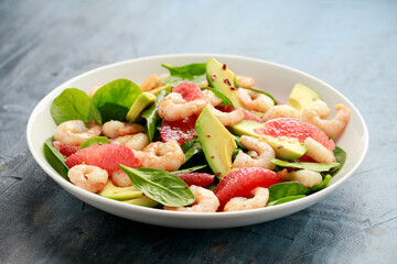 Fresh Avocado Grapefruit shrimp salad in white plate