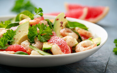 Fresh Avocado Grapefruit shrimp salad in white plate