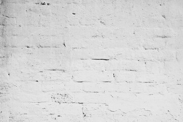 Texture of a brick wall with cracks and scratches which can be used as a background
