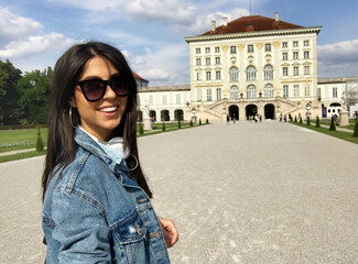 Fototapeta premium Portrait of Beautiful Young Brunette Woman with Sunglasses on the Street 