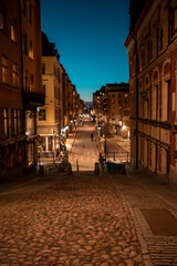 Stockholm, Sweden. Cobbled street in Sodermalm. Color street with cobblestone road, streetlight. Narrow street