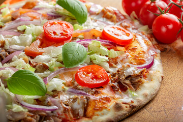 Kebab pizza with tomato slices