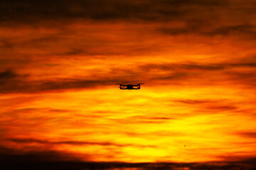 Fototapeta na wymiar Drone in flight with sunset - DJI Mini 2
