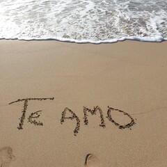 Fototapeta na wymiar I love you in the sand on the beach of Palma de Mallorca