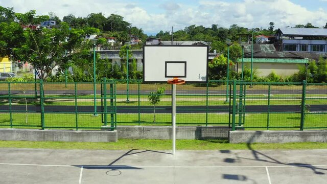 Front view; zooming out on a basketball hoop or goal 