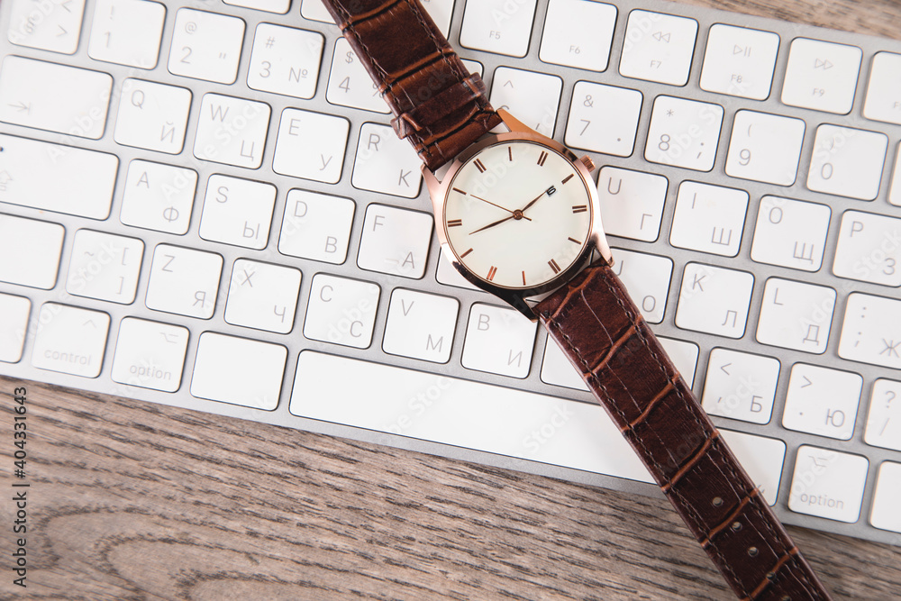 Poster watch on computer keyboard