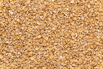 Macro of steel-cut oats, or Irish oats, background and texture.