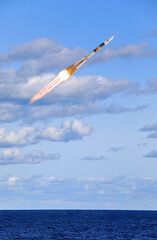 Fototapeta na wymiar Rocket spaceship. Blue skies. The elements of this image furnished by NASA.