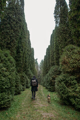 man with a dog in the botanical garden