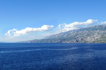 Mountain range along the blue sea, clear, unpolluted nature