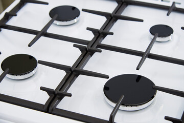 Gas burners on a stove hob in the kitchen