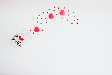 Fototapeta na wymiar romantic jar and red hearts. valentine's day 