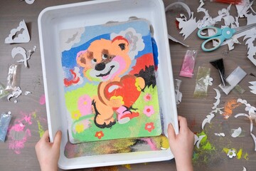 Painting for drawing with colored sand. Mural. The concept of children's creativity. Children art project. DIY concept. Step by step photo instruction.View from above. Work with children and adults 