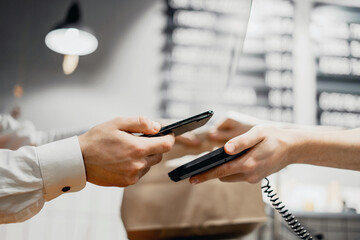 online payment. Sells takeaway food to a customer. Phone in hand for shopping in a cafe