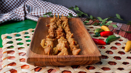 Fototapeta premium selective focus - sate usus or chiken intestines satay. traditional Indonesian street food