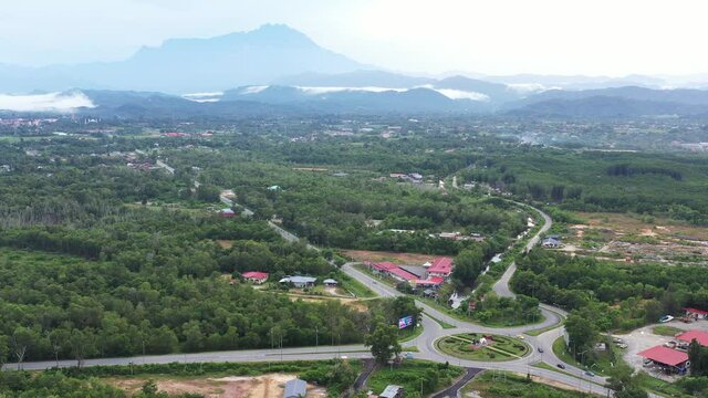 Aerial drone footage view of tuaran district with mount kinabalu at background