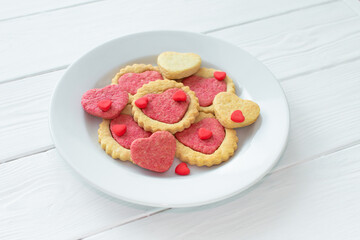 Valentine's day cookies on a plate Step by step 5. Cooking instructions. Love concept. Homemade heart shaped cookies. Delicious natural organic cookies, baked goods with love for valentines day