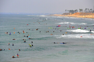 The view of surfers waiting for the big waves near Huntingdon Beach, California, U.S.A