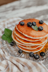 Fresh Pancakes on Plate. Close up of Delicious Dessert. Pancakes and Bluberry on top.