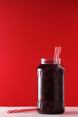 Cherry compote in a glass jar