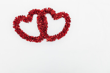 Two red hearts on a white background